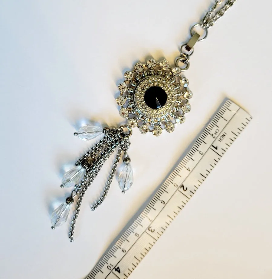 Necklace with detachable tassle pendant and snap
