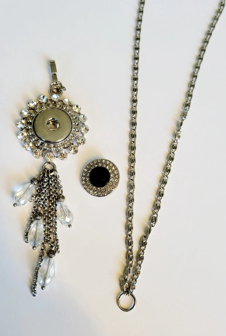 Necklace with detachable tassle pendant and snap